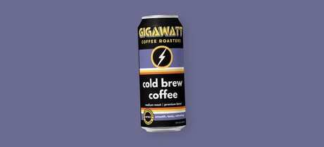 A can of Gigawatt Coffee Roasters cold brew coffee, medium roast with a light nitrogen infusion, on a purple background