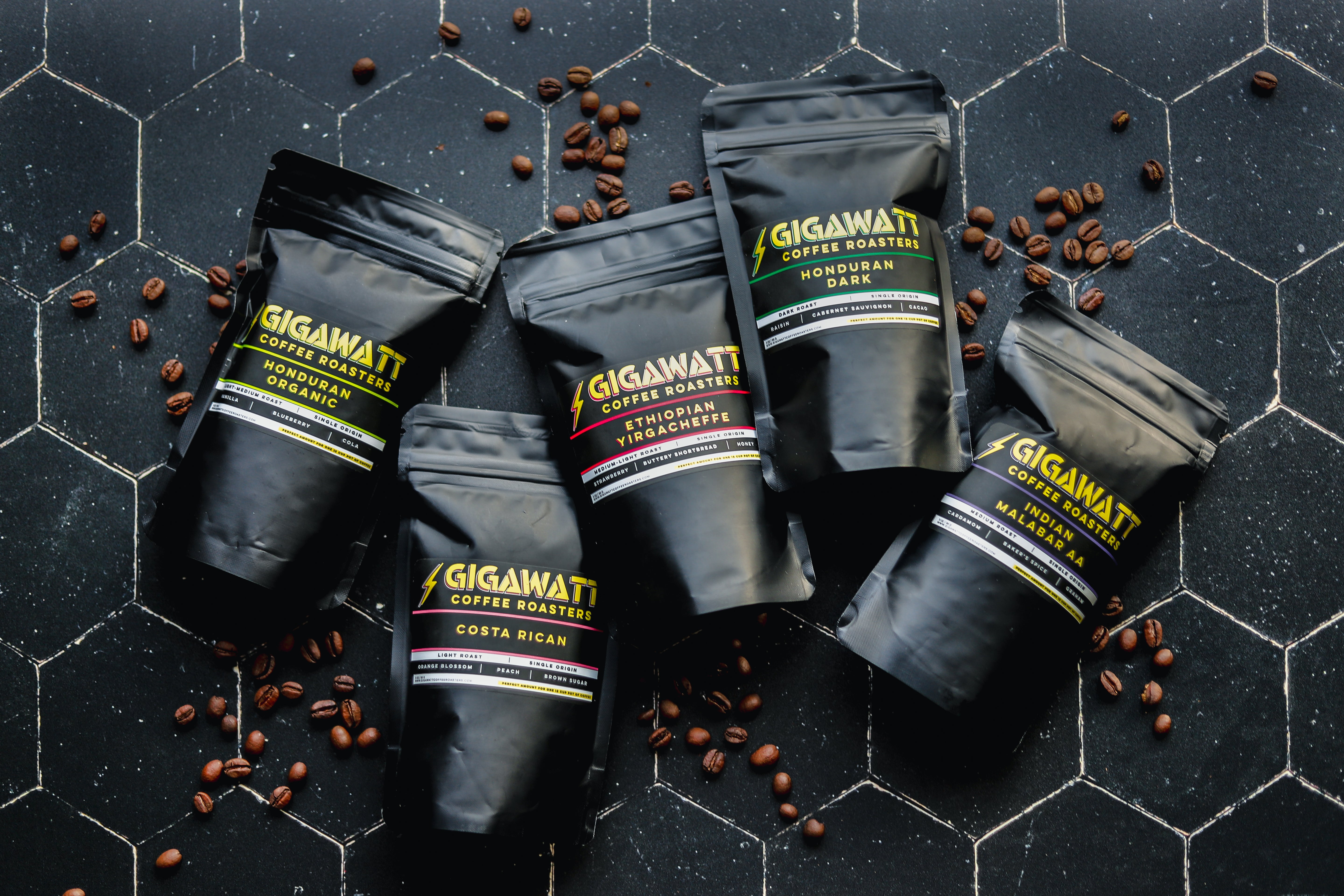Five Gigawatt Coffee Sampler packs on black tile.