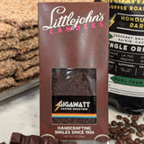72% dark chocolate bar made with organic Honduran coffee by Gigawatt Coffee Roasters and Littlejohn's Candies on a surface with chocolate and coffee beans