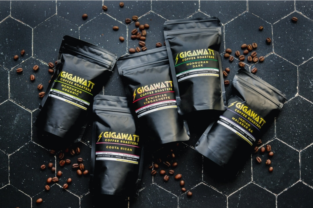 Five Black Bags of Gigawatt Coffee Bean Sampler Pack.