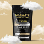 Gigawatt Coffee Mexican Chiapas Coffee, single origin medium roast with smooth cinnamon toast, vanilla, and cacao notes. 10 oz, displayed on a counter.
