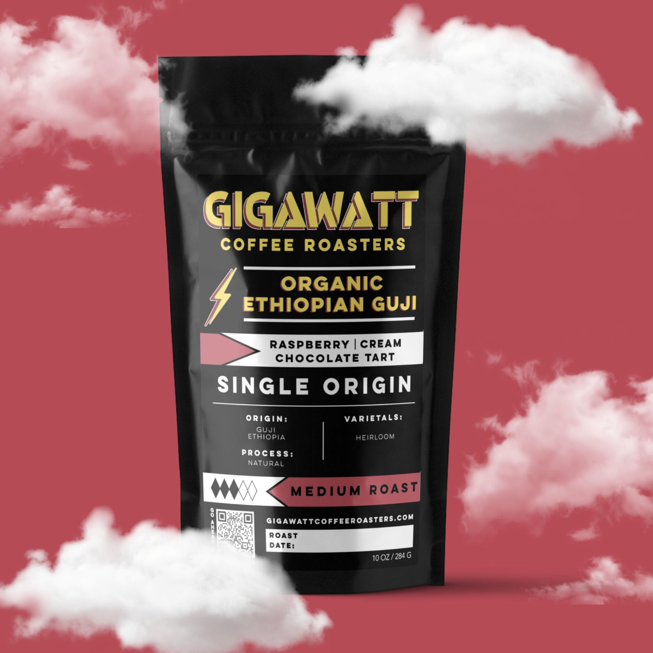 Gigawatt Coffee Organic Ethiopian Guji Coffee, single origin medium roast with raspberry, cream, and chocolate tart notes. 10 oz, set against a cloud-filled background.