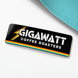 Gigawatt Coffee Roasters 3 by 1 inch mini rectangle sticker with the Gigawatt wordmark, gloss finish