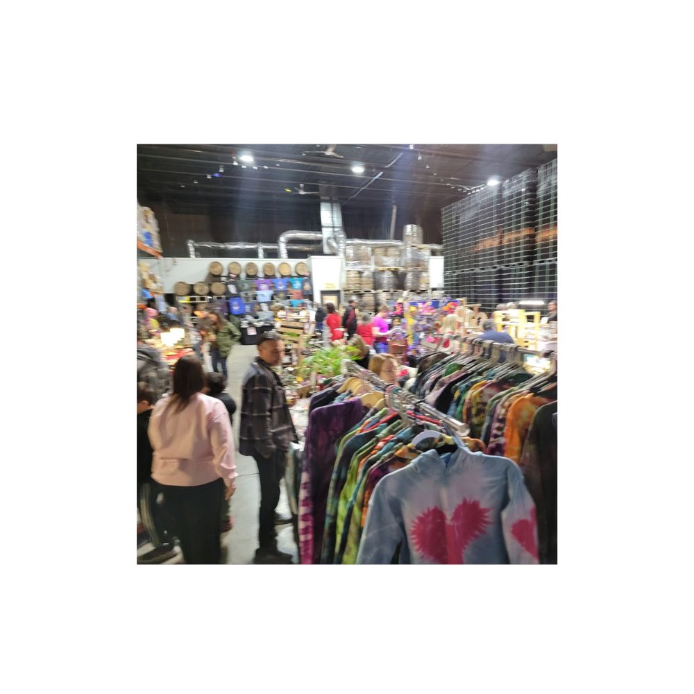 Shoppers browsing handmade vendor booths at the Spring Artisan Market at Phase Three Brewing in Lake Zurich, IL on April 26, 2025.